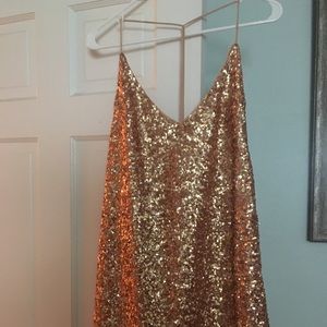 Gold sequin A-line mini dress with strappy back